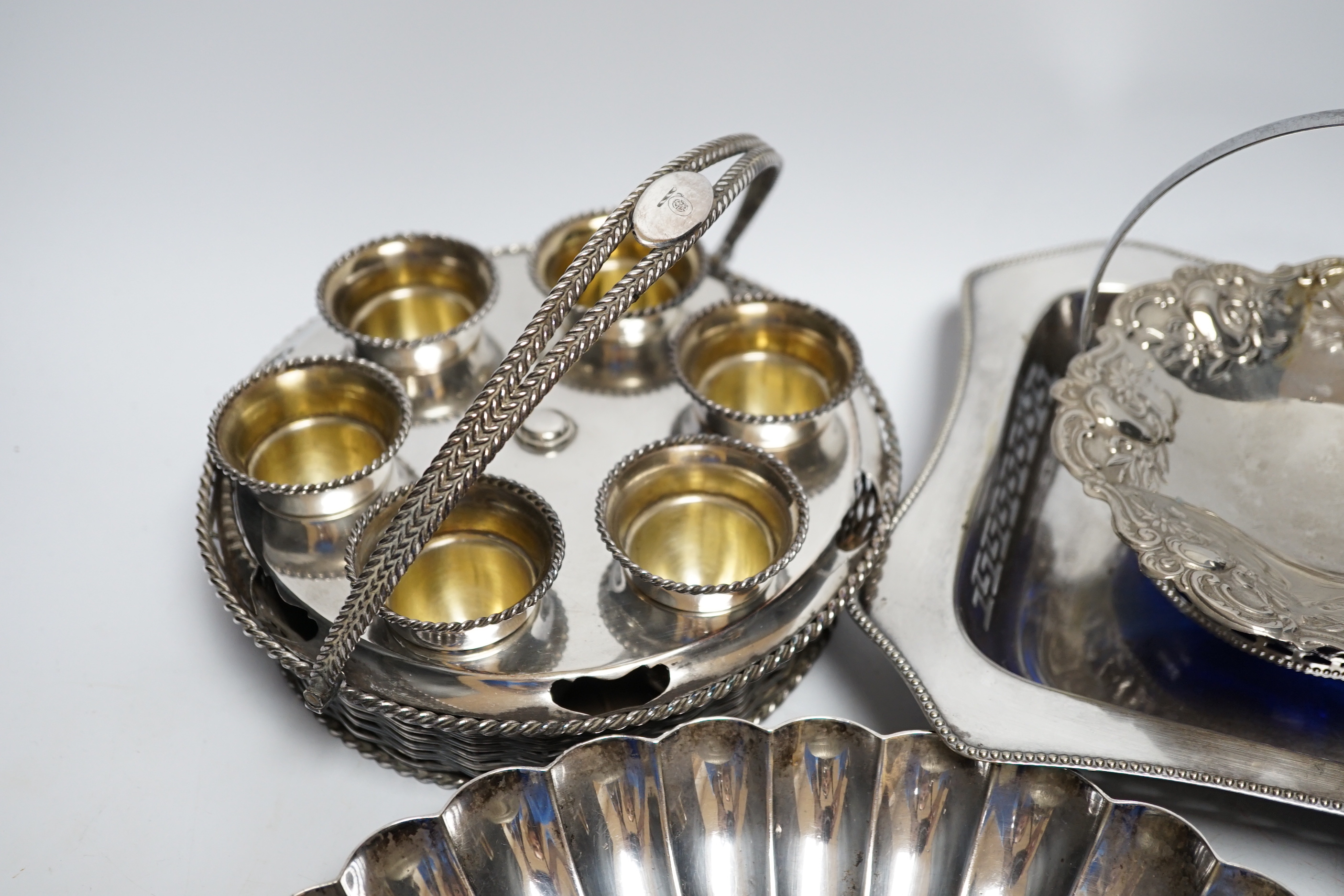 A plated egg cruet and sundry plate